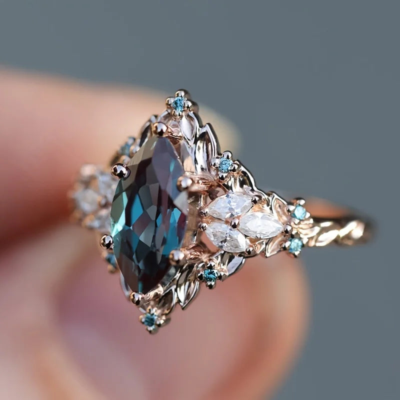Elegant Marquise Synthetic Crystal Engagement Ring for Women | Copper 6-Prong Set, June Birthstone, Rose-Tone Leaf Design