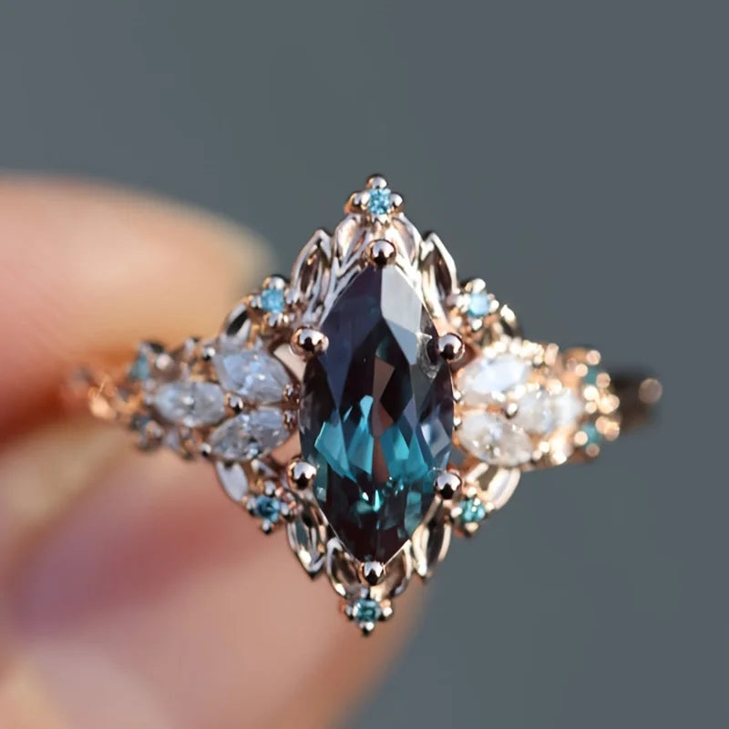 Elegant Marquise Synthetic Crystal Engagement Ring for Women | Copper 6-Prong Set, June Birthstone, Rose-Tone Leaf Design