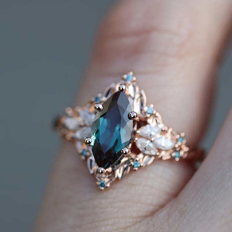 Elegant Marquise Synthetic Crystal Engagement Ring for Women | Copper 6-Prong Set, June Birthstone, Rose-Tone Leaf Design